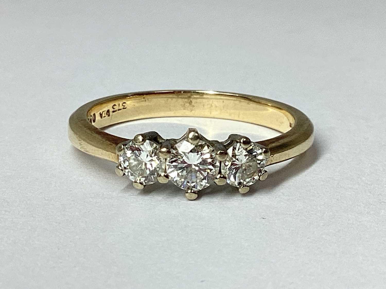 Lot 30 - A 9ct Gold Three Stone Diamond Ring, of