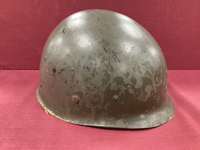 Lot 768 - United States M1 combat helmet liner with...