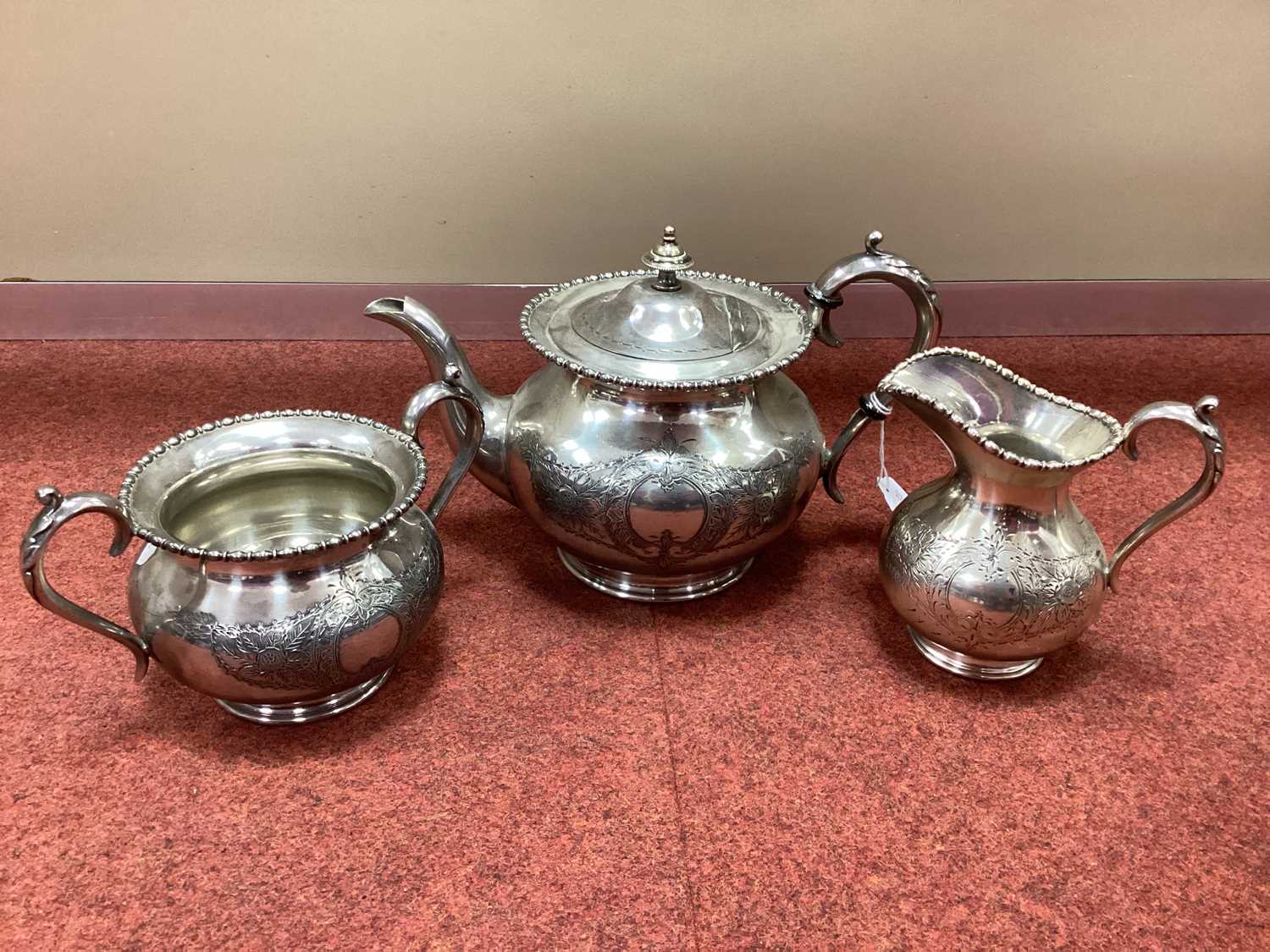 Lot 27 - An EPBM Three Piece Tea Set, each with floral...