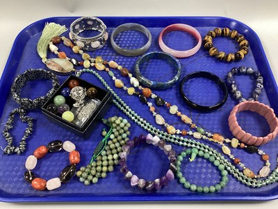 Lot 88 - Modern Polished Hardstone Bracelets and...