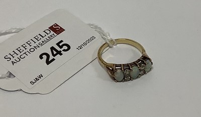 Lot 245 - An Opal and Diamond Ring, alternately claw set...