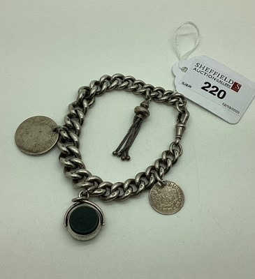 Lot 220 - A Graduated Curb Link Bracelet, suspending...