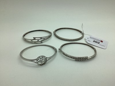 Lot 202 - A Modern Diamonique DQCZ Hinged Bangle,...