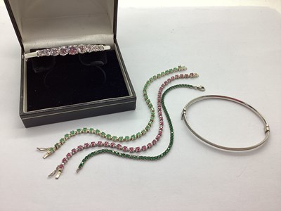 Lot 57 - Diamonique; A Nine Stone Claw Set Hinged...