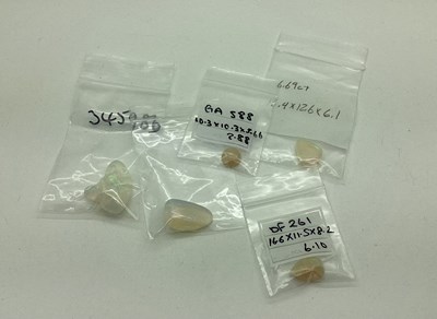 Lot 144 - Five Unmounted Polished Opals, irregular, pear,...