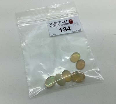Lot 134 - Six Unmounted Oval Faceted Opals,...