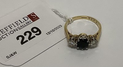 Lot 229 - A Sapphire and Diamond Three Stone Ring, claw...
