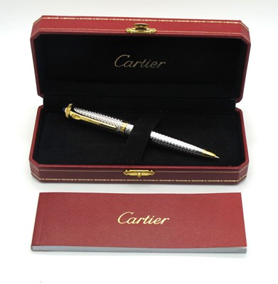 Lot 1312 - A Cartier Ballpoint Pen, in an engine turned...