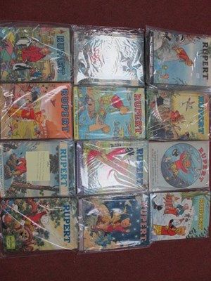 Lot 405 - Sixteen 1960's/1970's Rupert Annuals & Books...