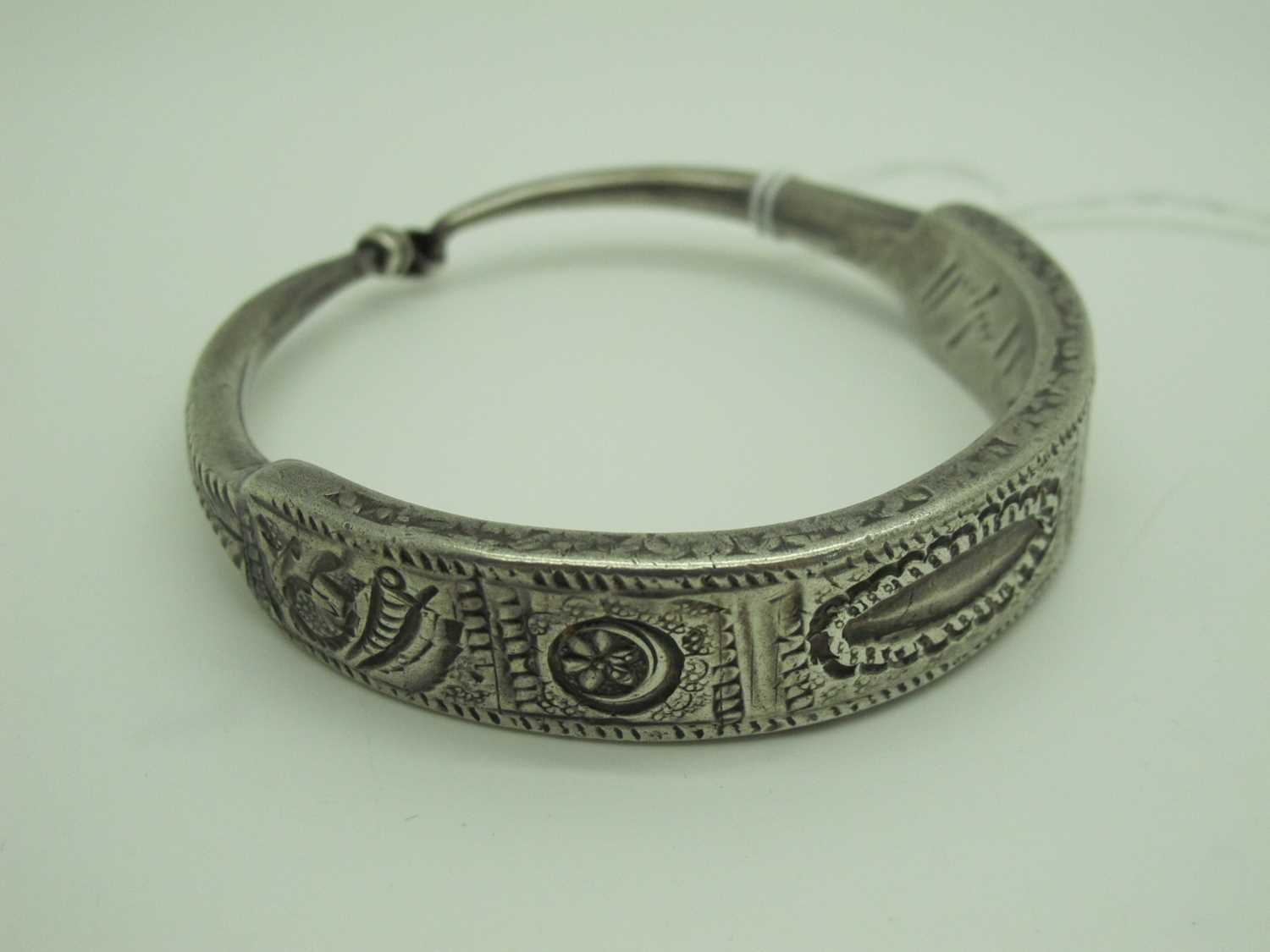 Lot 187 - A Libyan Temporal / Ear Ornament, (originally...