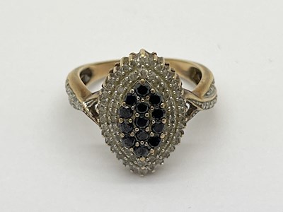 Lot 51 - A Diamond and Sapphire Set Dress Ring, of...