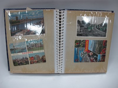 Lot 1364 - A postcard album filled with a mixture of...