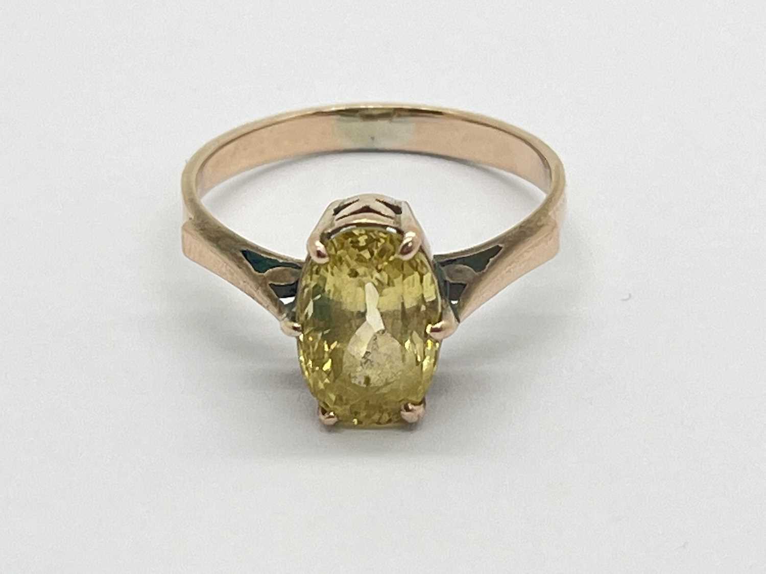 Lot 51 - An Oval Single Stone Dress Ring, claw set...