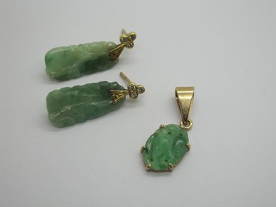 Lot 76 - A Pair of Carved Jade Drop Earrings, each with...