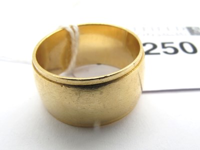 Lot 250 - A Wide Reeded Wedding Band, stamped "RSO 14K"...