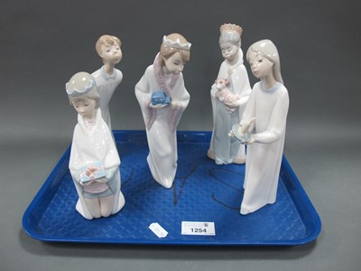 Lot 1254 - Lladro Figurines - three wearing crowns, the...