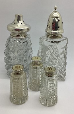 Lot 416 - Two Hallmarked Silver Topped Glass Sugar...