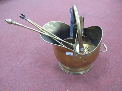 Lot 1394 - XIX Century Brass Coal Helmet, fire irons,...