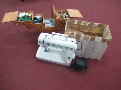 Lot 1385 - Toyota sewing machine together with a wooden...