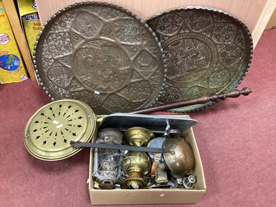 Lot 1121 - Two Embossed Brass Chargers, (one featuring...