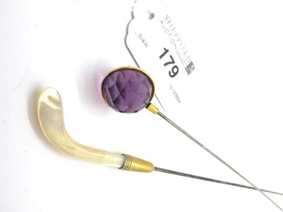 Lot 179 - A Faceted Stone Hatpin, the stone of circular...