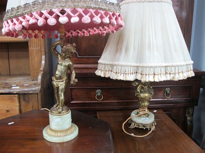 Lot 1529 - Gilt and Onyx Table Lamps, one with boy...
