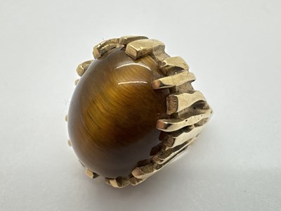 Lot 282 - A Modernist 9ct Gold Tiger's Eye Single Stone...