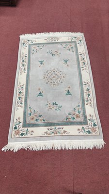 Lot 1517 - Chinese Wool Tassled Rug, with symmetrical...