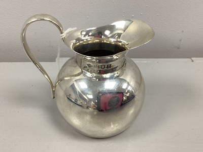 Lot 10 - An Edwardian Hallmarked Silver Cream Jug,...