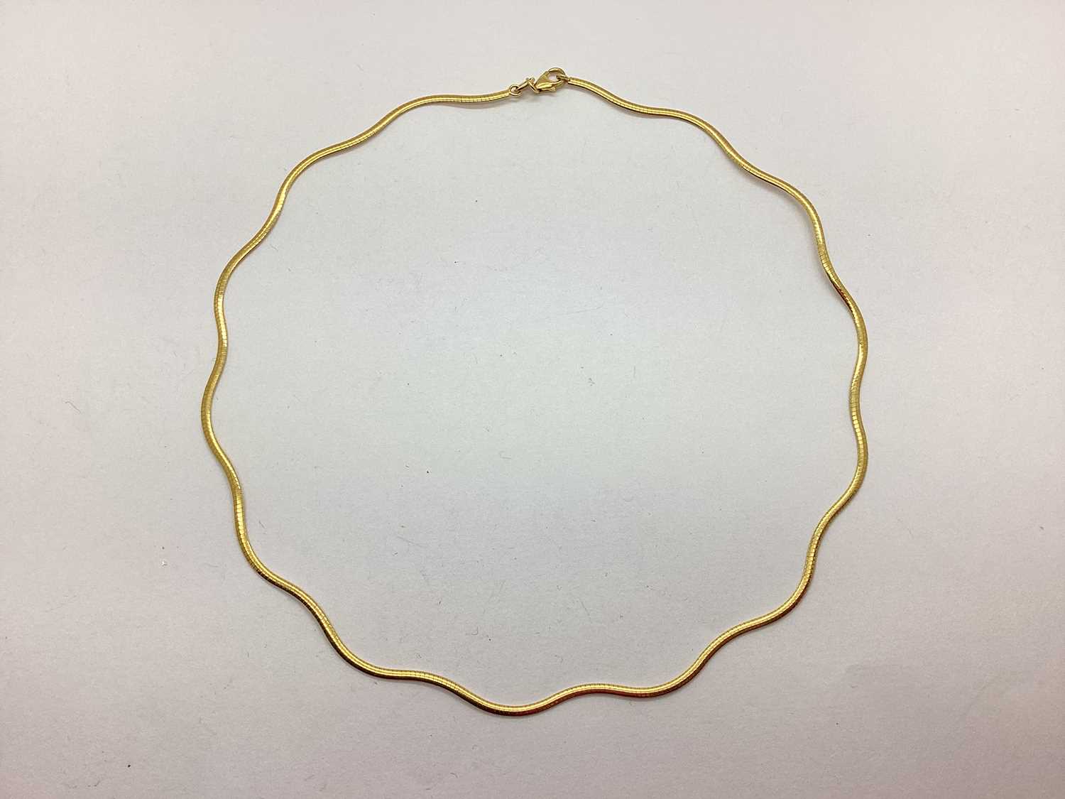 Lot 62 - A 9ct Gold Modern Wavy Flat Link Collarette...