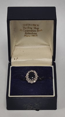 Lot 45 - A 9ct Gold Stone Set Cluster Ring, the oval...