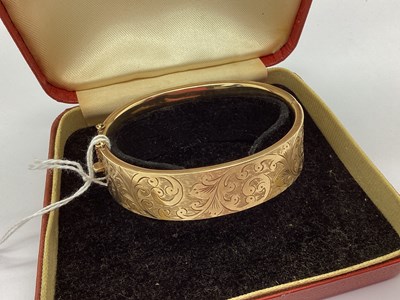 Lot 231 - A Vintage 9ct Gold Wide Bangle, the hinged...