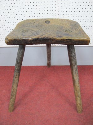 Lot 1530 - A XIX Century Elm Cutlers Stool, 54cm high.