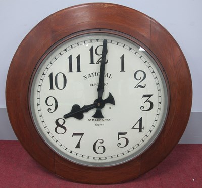 Lot 1473 - A Large 1920's Oak Cased Wall Clock, the white...