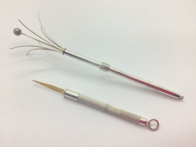Lot 141 - A Champagne Twizzler, together with a sliding...