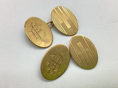 Lot 360 - A Pair of 9ct Gold Cufflinks, the oval panels...