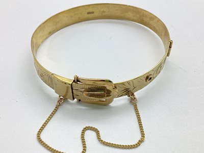 Lot 235 - A 9ct Gold Vintage Hinged Buckle Bangle,...