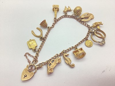 Lot 220 - A 9ct Gold Curb Link Charm Bracelet, to heart...