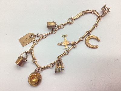 Lot 221 - A Vintage Charm Bracelet, clasp indistinctly...