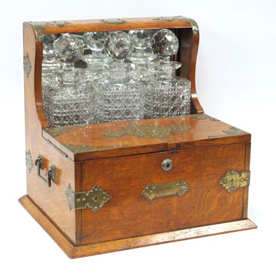 Lot 1289 - An Early XX Century Oak Cased Tantalus, with...