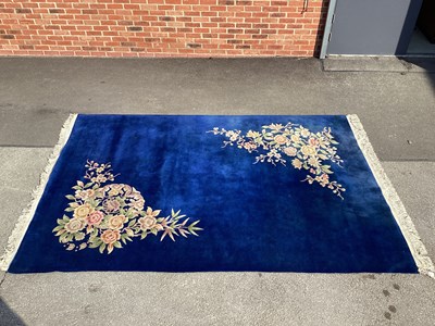 Lot 1530 - XX Century Wool Carpet with a Blue Ground with...