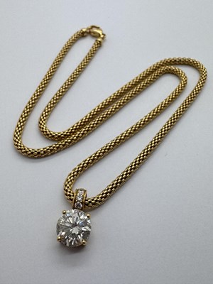 Lot 172 - An 18ct Gold Fancy Link Chain, suspending a...