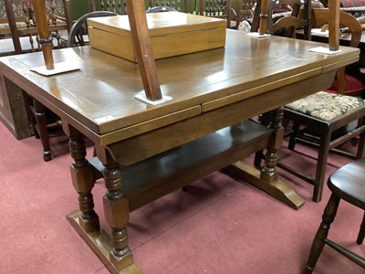 Lot 1546 - 'Old Charm' Oak Draw Leaf Table, on turned and...