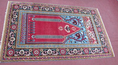 Lot 1555 - A Middle Eastern Prayer Rug, with central...