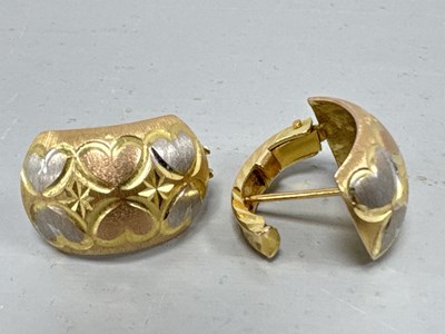 Lot 77 - A Pair of Tri-Colour Hoop Earrings, the front...
