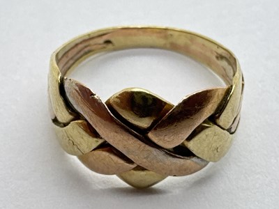 Lot 36 - A Two-Colour Abstract Style Ring, of weaved...