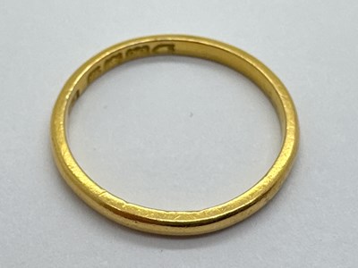 Lot 28 - A 22ct Gold Slim Wedding Band, of plain design...