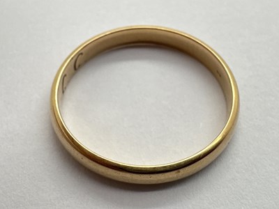 Lot 39 - A Slim Wedding Band, of plain design, engraved...