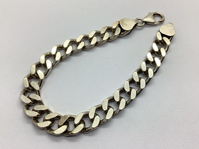 Lot 104 - A Chunky Curb Link Bracelet, stamped "925",...