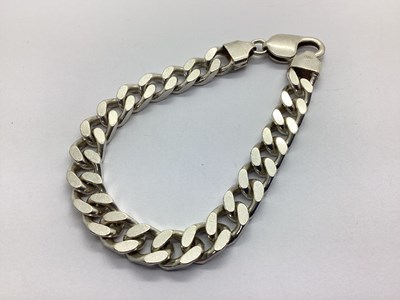 Lot 115 - A Chunky Curb Link Bracelet, to clasp stamped "...